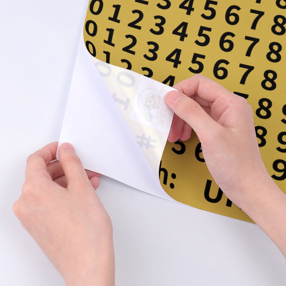 A4 Size Sheet of black numbers on Gold Style colour to match our metal signs. UHF Phone Number and 0-9 stickers 1cm high. + Hands for scale suggestion